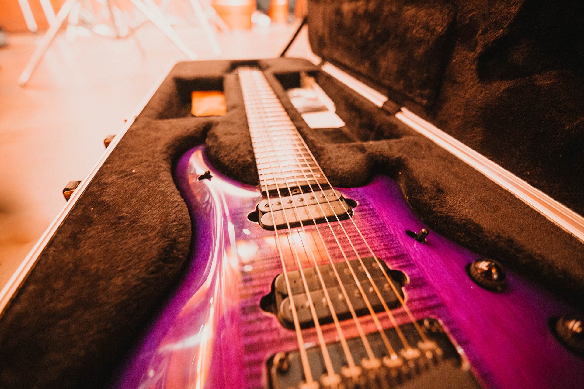 a pink 7 string electric guitar